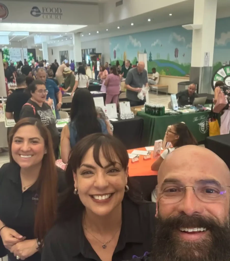 Davis Dental team members taking a selfie at a community event