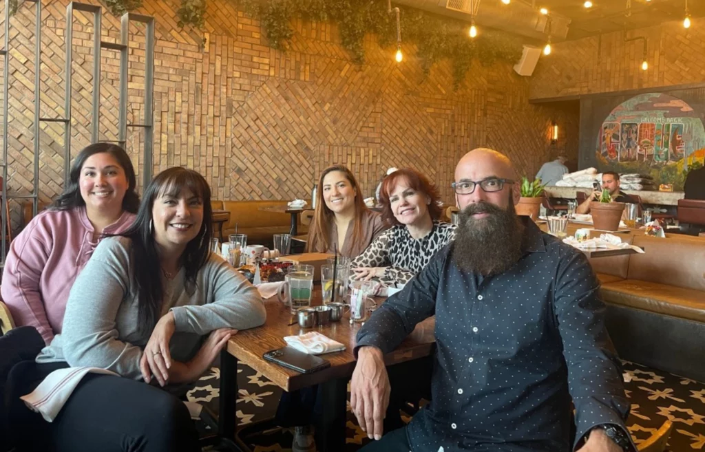 The Davis Dental team sharing a meal at a restaurant