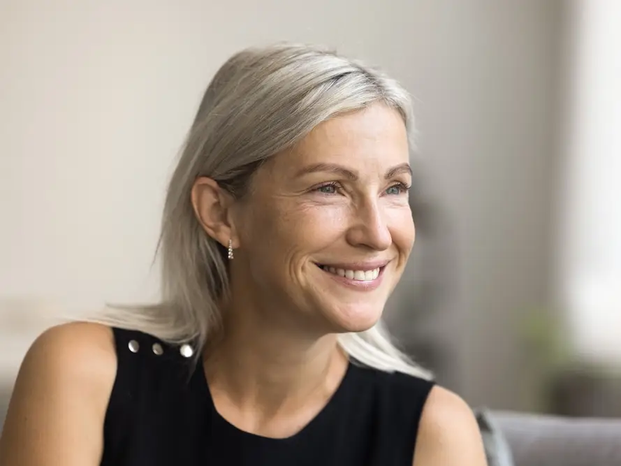 Smiling woman with silver hair