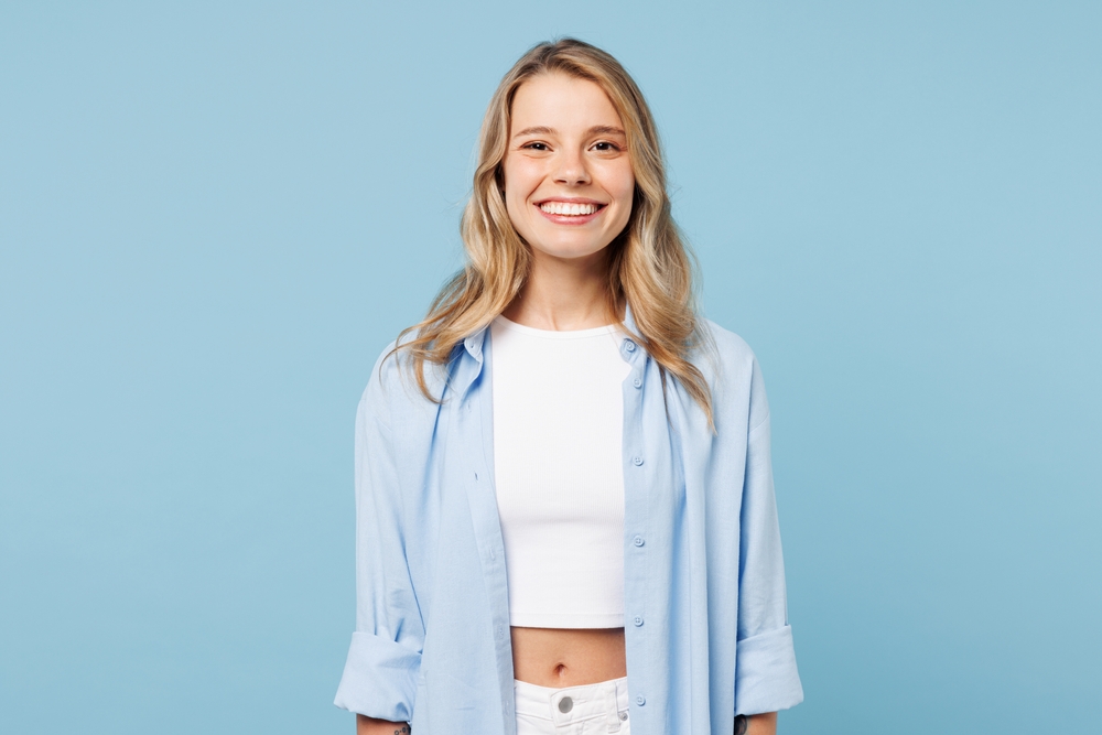 Smiling young woman with long blonde hair