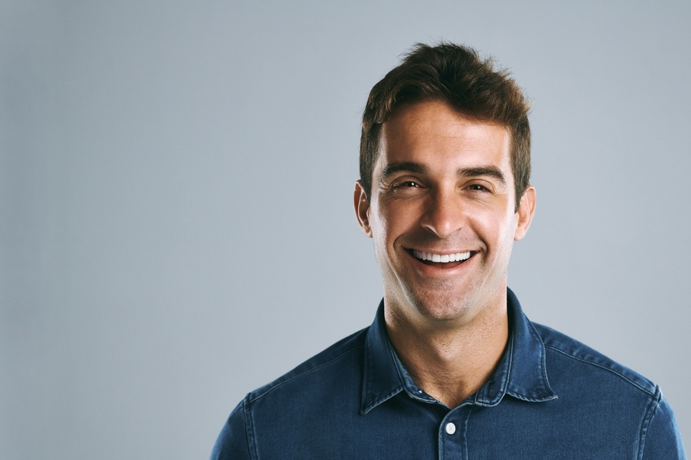 Smiling man in a denim shirt