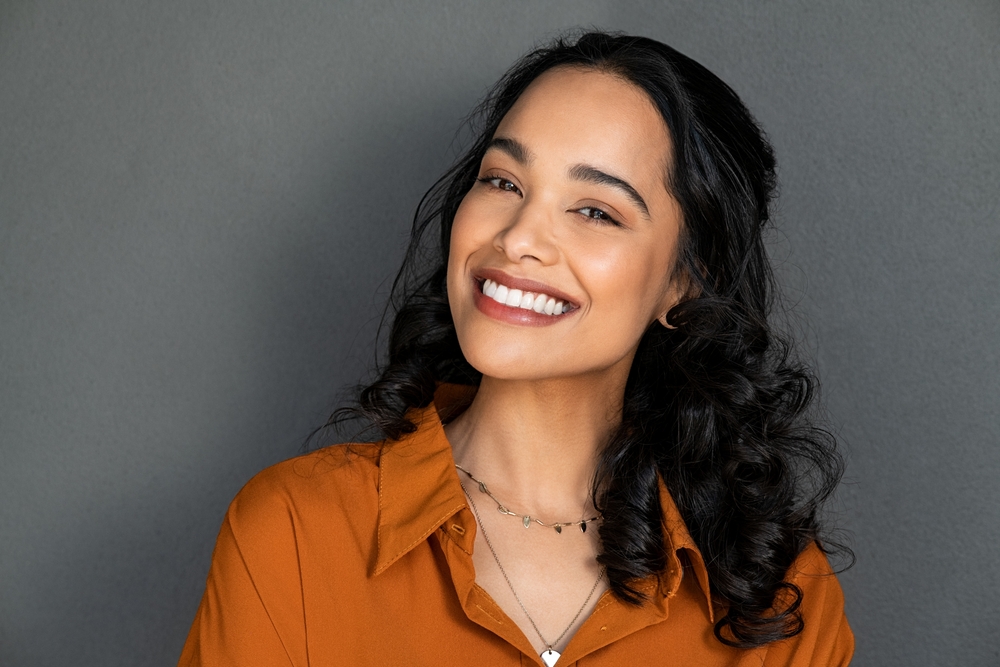 Smiling woman with long dark hair