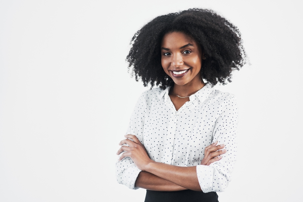 Smiling woman with her arms crossed