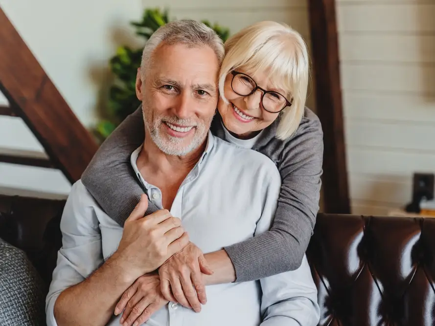 Smiling older couple at home